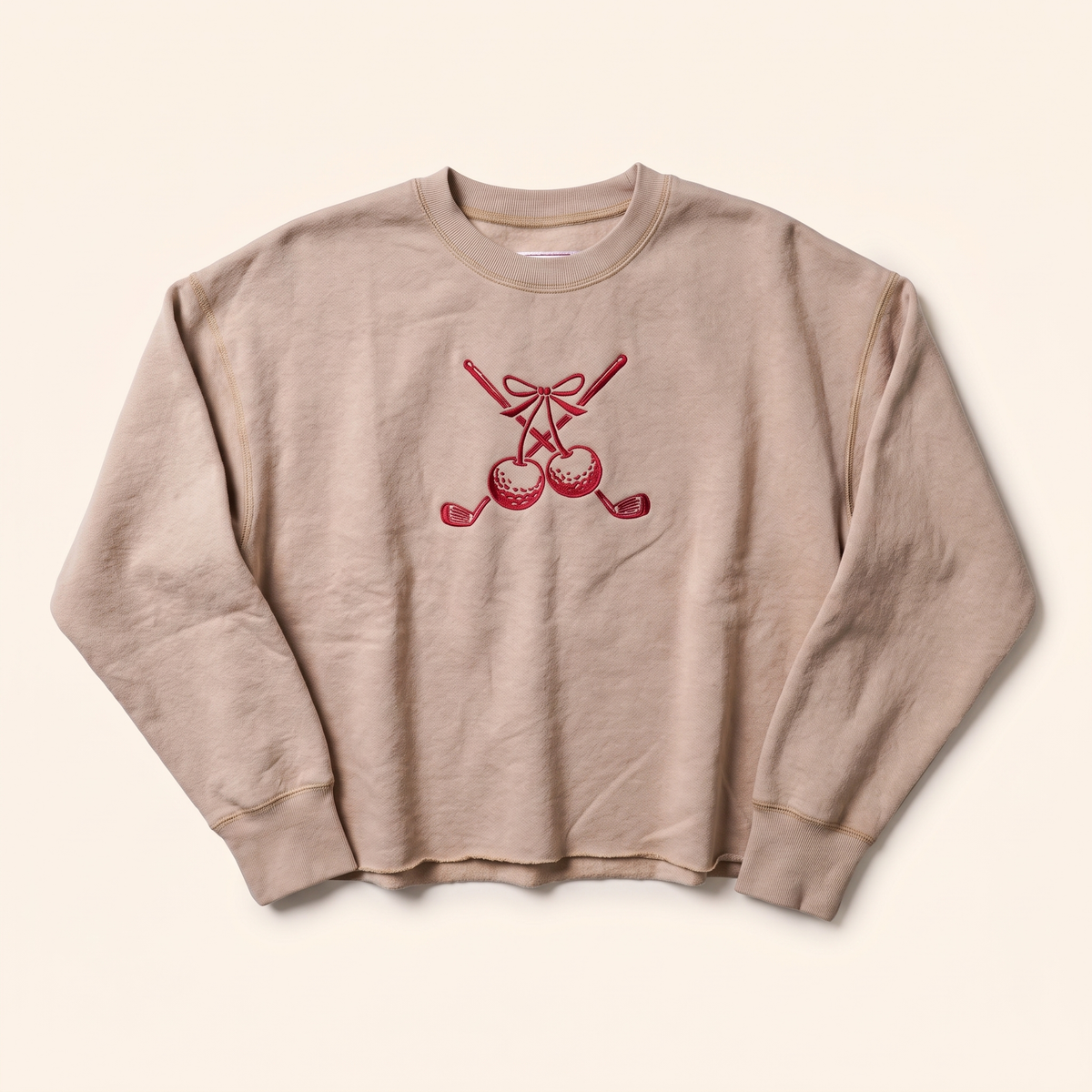 Sand cropped crewneck with red cherry and crossed clubs embroidery