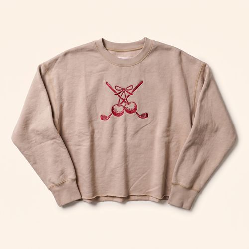 Sand cropped crewneck with red cherry and crossed clubs embroidery