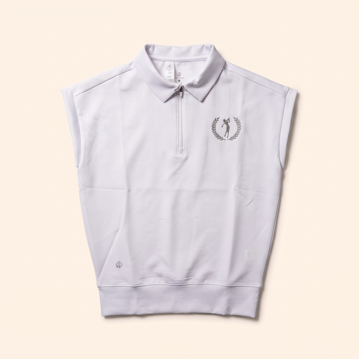 White sleeveless quarter-zip polo with laurel golfer crest