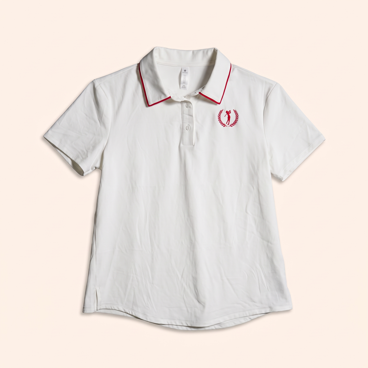 White short-sleeve polo with red laurel golfer crest