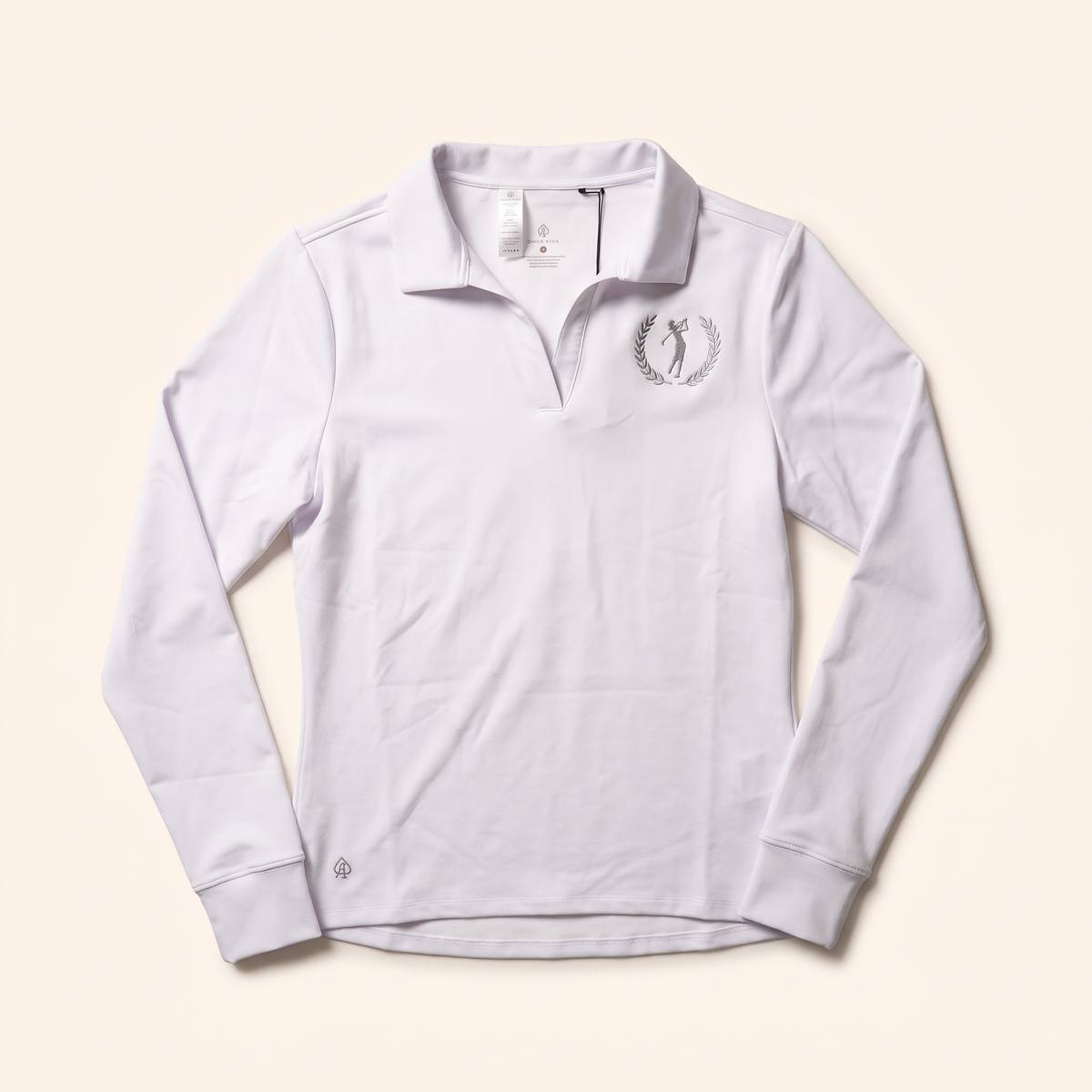 White long-sleeve collared polo with laurel golfer crest