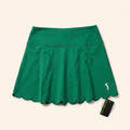 Green scalloped-hem skort with golfer mark