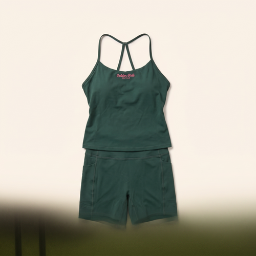 Green bike shorts styled with the script cami