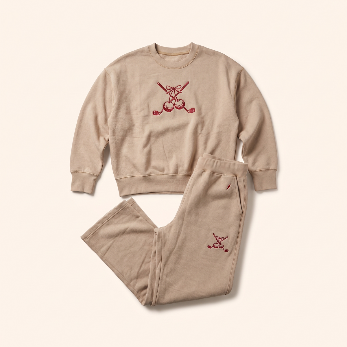 Sand sweatpants styled with the matching cherry crewneck