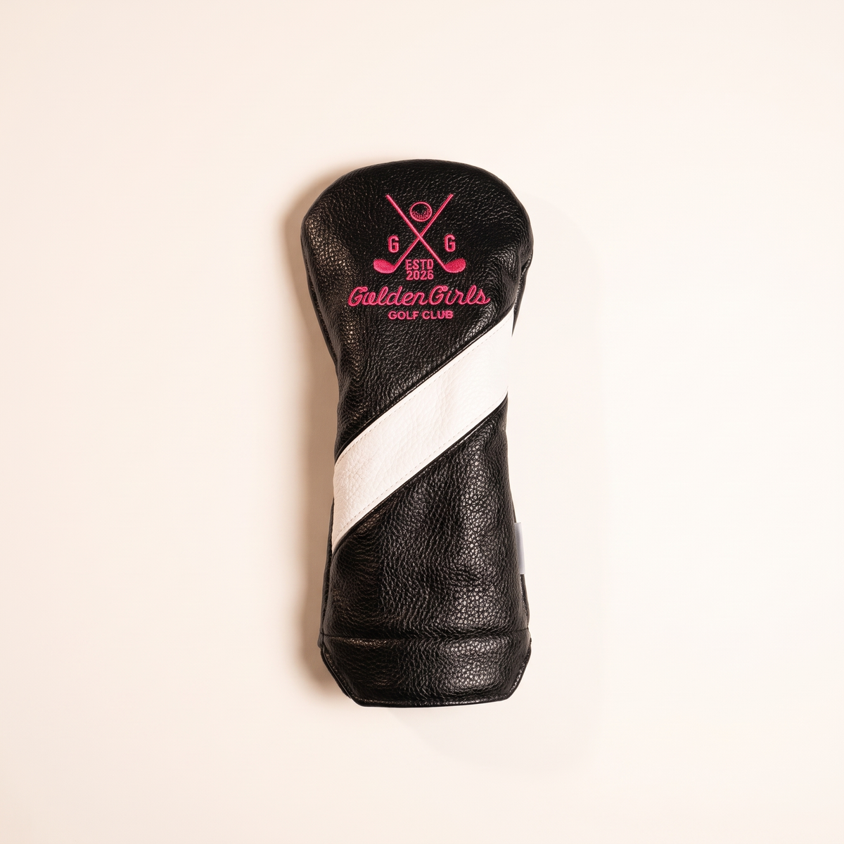 Black leather driver headcover with pink crossed clubs crest