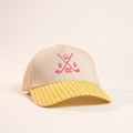 Sand cap with pink crossed clubs crest and yellow stripe brim